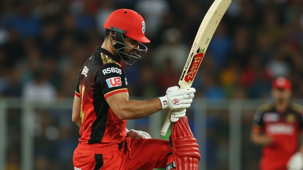 Fielding captain talking to bowler during a rain-affected IPL fixture as conditions begin to dry